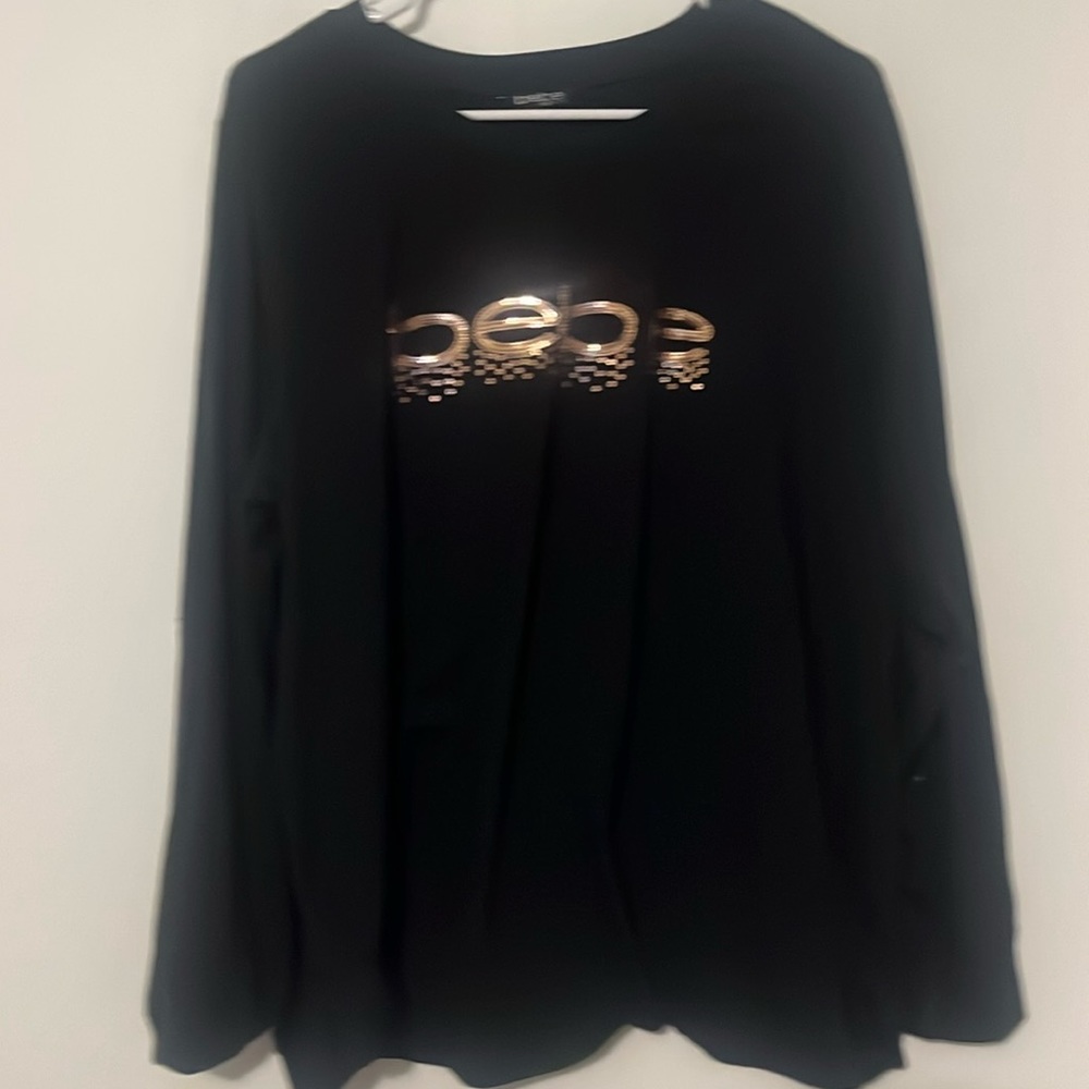 3X long sleeve black tshirt with BEBE logo in rose gold. Hoop earrings included.
